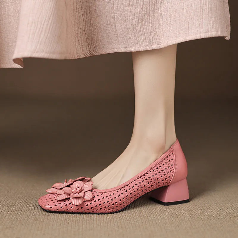 Women's light brown cowhide leather open weave pumps with a mid heel on a neutral background.