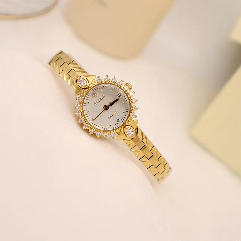 Women's vintage-style quartz watch with diamond-embossed gold bracelet