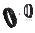 Black Xiaomi Mi Band 2 smartband with OLED display on a thermoplastic wrist strap.