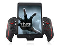 Wireless telescopic game controller extended to hold a mobile phone, showing USB port and buttons.