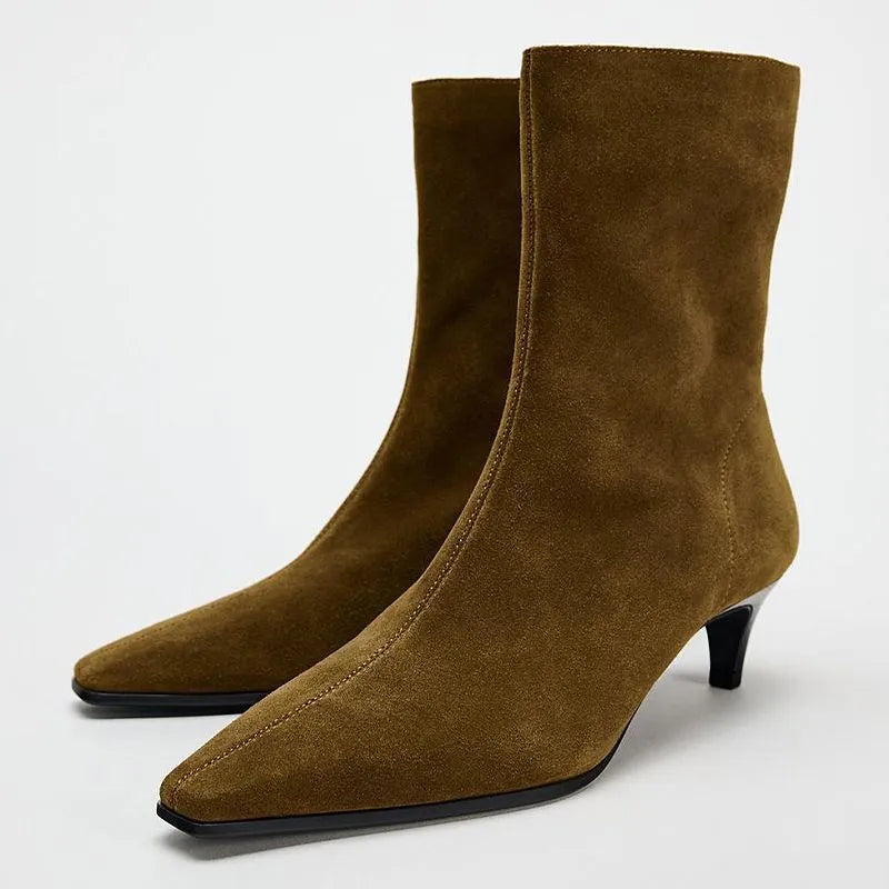 Brown square toe ankle boots with a side zip and a waterproof platform kitten heel.