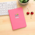 Leather A5 notebook with elastic strap closure showing beige paper pages in blue cover option