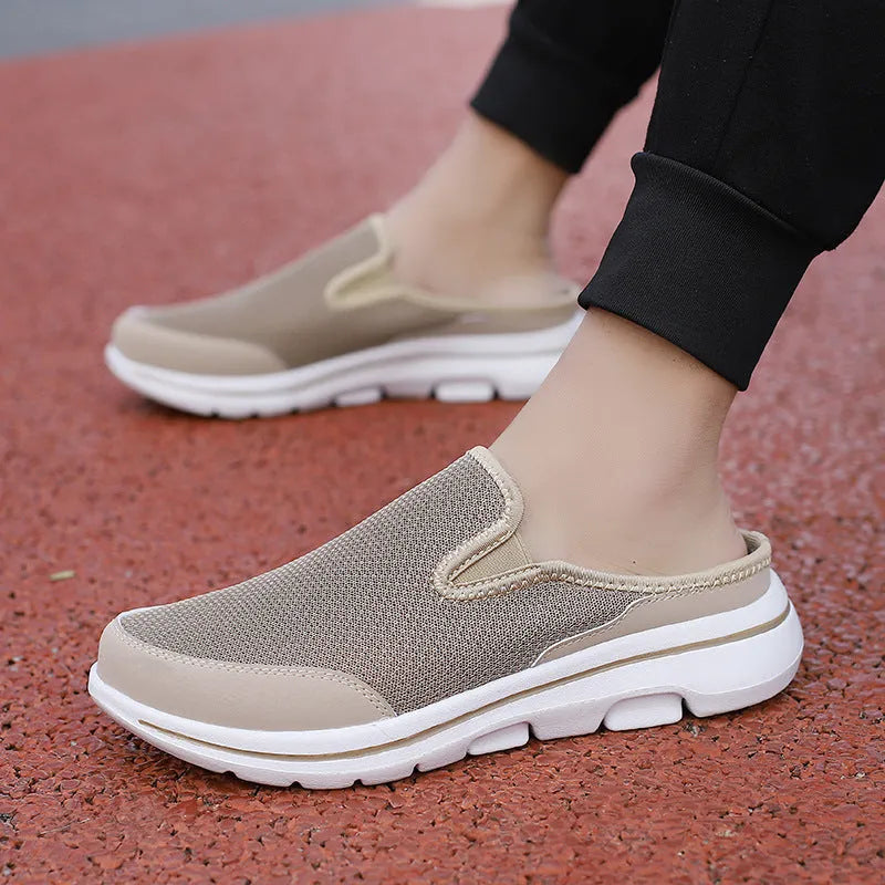Breathable mesh toe holder slippers in solid colours on a flat heel sole.