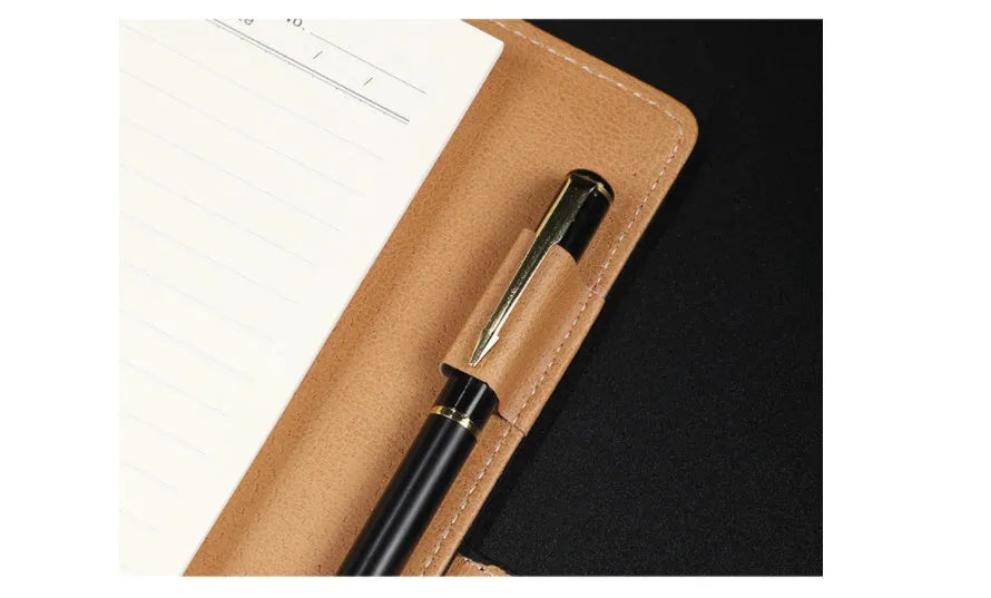 Hardcover A5 leather notebook with buckle closure in five colour options showing interior Daolin paper