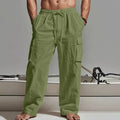 Man wearing loose beige cotton wide-leg casual trousers with a relaxed fit.