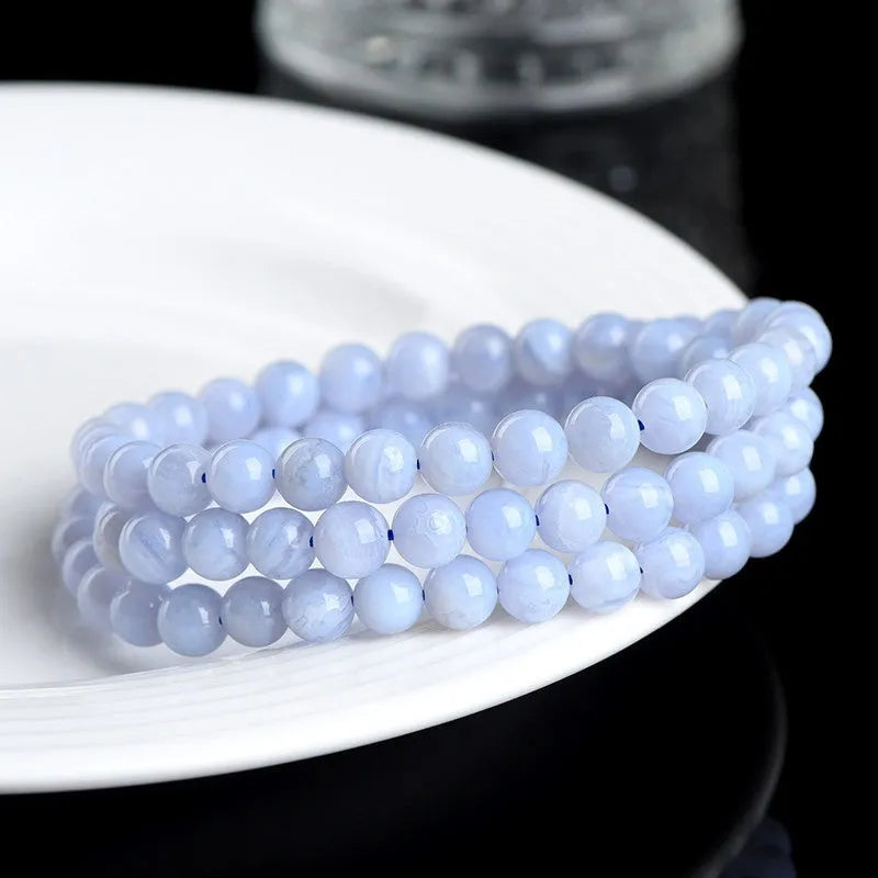 Original blue agate bracelet with multi-circle patterned beads and Ruyi design elements.