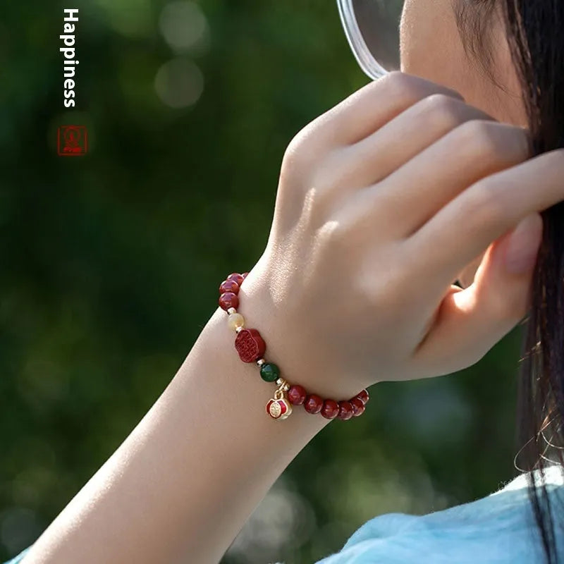 New Chinese style bracelet with emperor sandstone beads and a red Fu character charm.