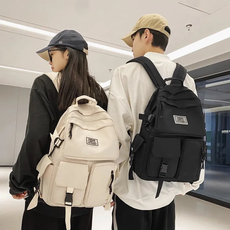 Black or white nylon student backpack with computer compartment and three-dimensional pockets