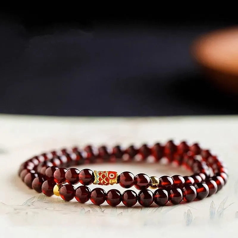 Wine red glass bead garnet bracelet with new Chinese style design showing single circle configuration