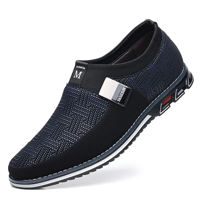 Men's grey and white synthetic leather slip-on loafers with a square toe and flat rubber sole.