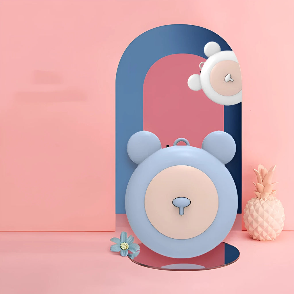 Portable necklace air purifier with sterilisation function in blue colour on a desk