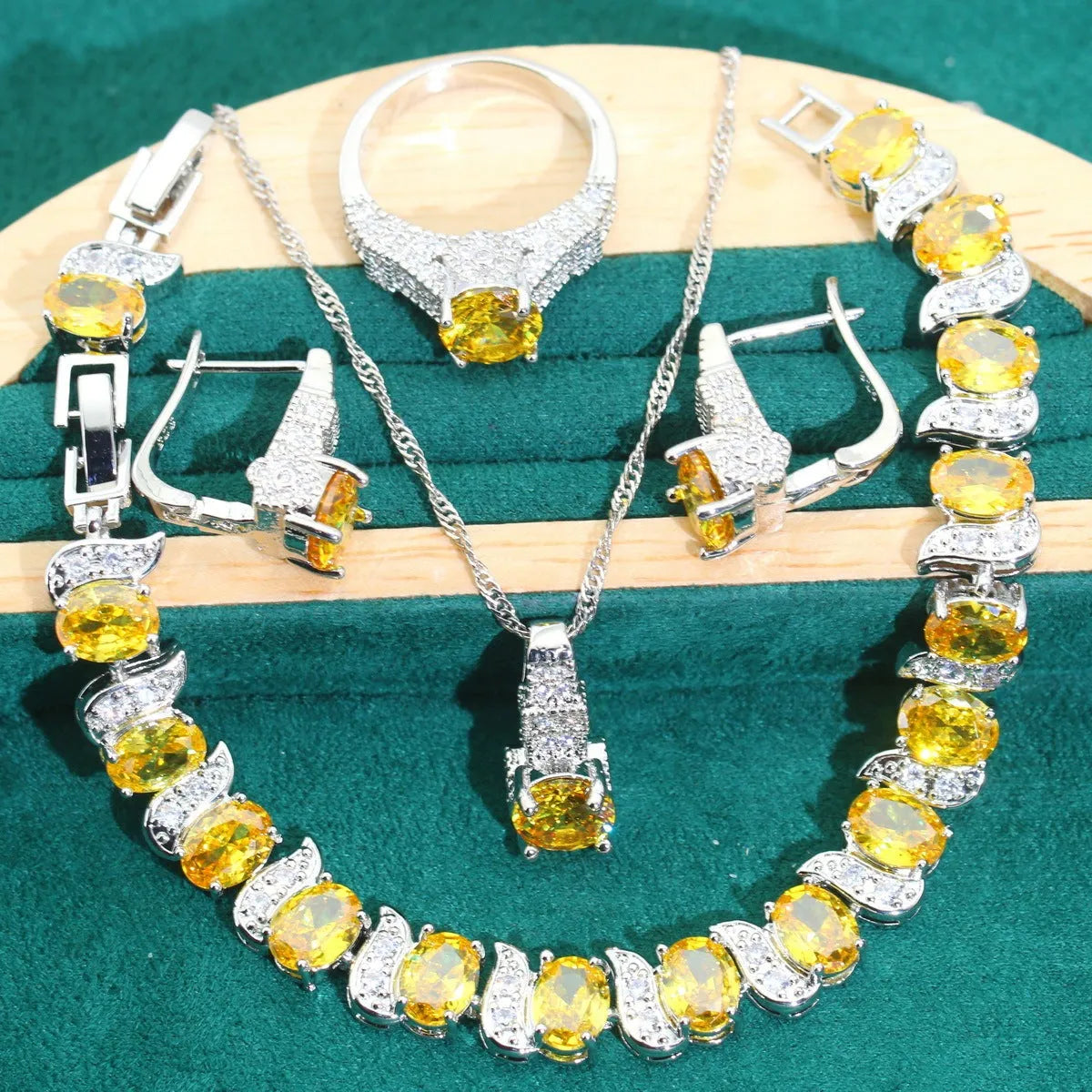 Four-piece bridal jewellery set showing necklace, bracelet, earrings and ring with alloy pendant and water wave chain