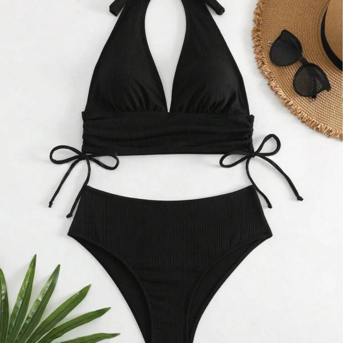 Women's black halter bikini with lace-up detail and briefs style bottom