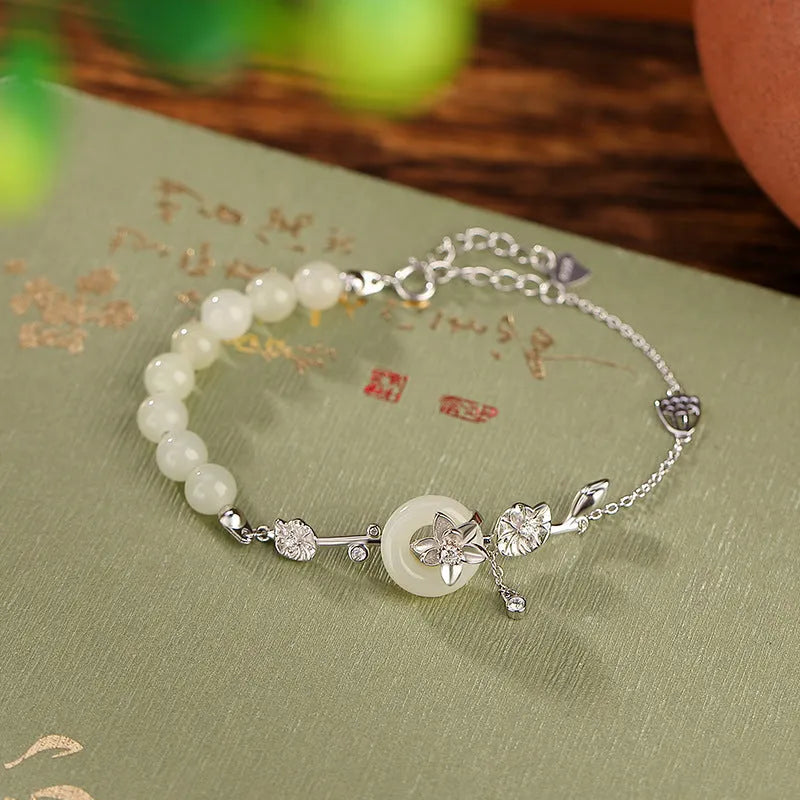 Women's retro bracelet with Hetian jade lotus peace buckle design in 925 silver