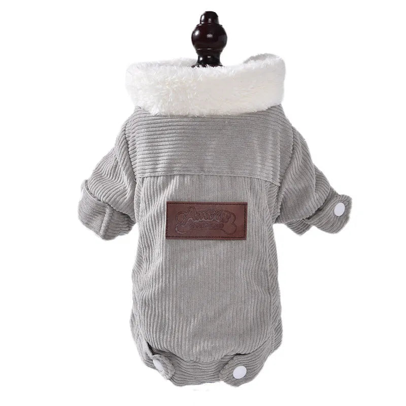 A grey lambswool-lined padded vest for dogs, shown on a mannequin, for winter warmth.