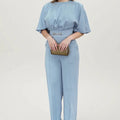 Blue polyester men's suit set with long sleeve jacket and trousers on a hanger.
