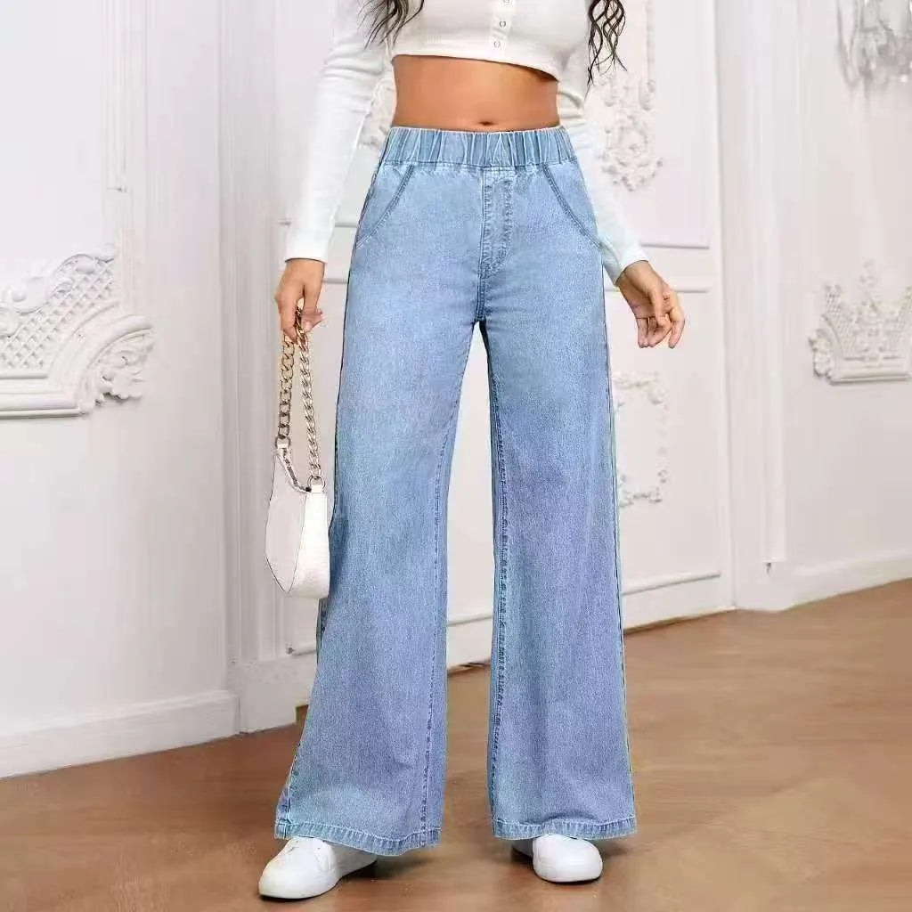 Light blue washed plus size women's wide-leg denim jeans with straight cut and zip fly