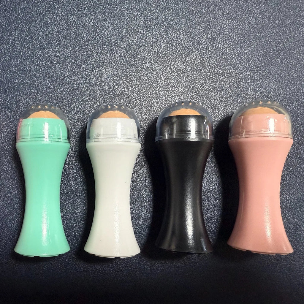 Volcanic stone facial roller for oily skin control in black, green, pink, and white colour options.