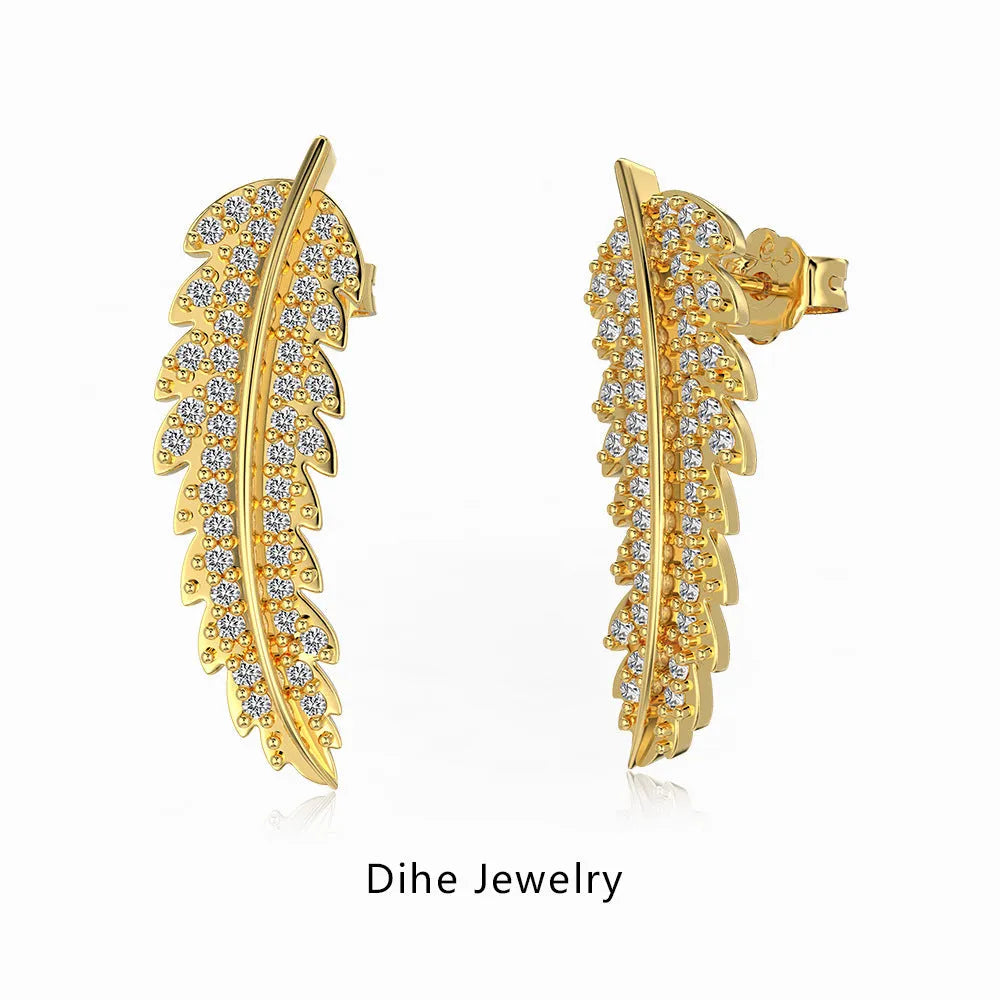 Leaf-shaped zircon inlaid S925 sterling silver stud earrings in gold colour on white background