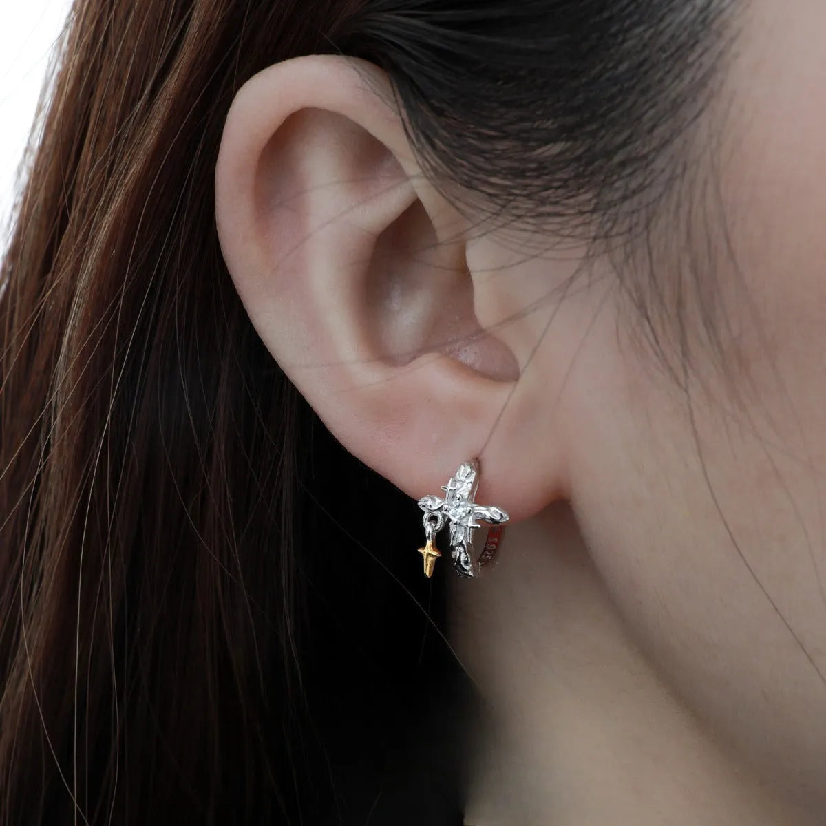 Pair of 925 sterling silver geometric cross earrings with white gold colour electroplated finish.