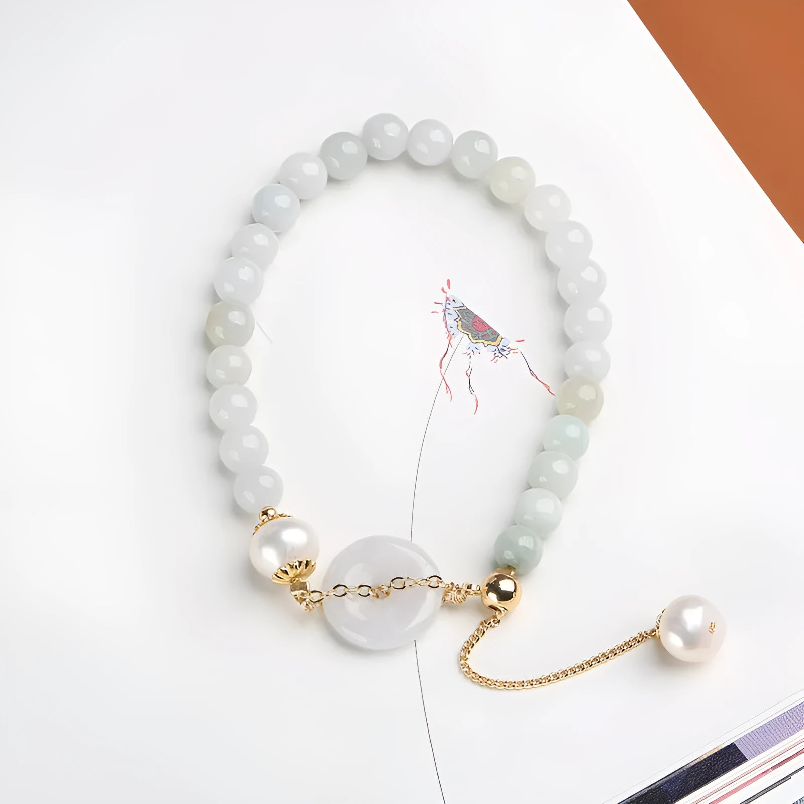 Natural jade peace buckle pearl bracelet with geometric pendant on wrist