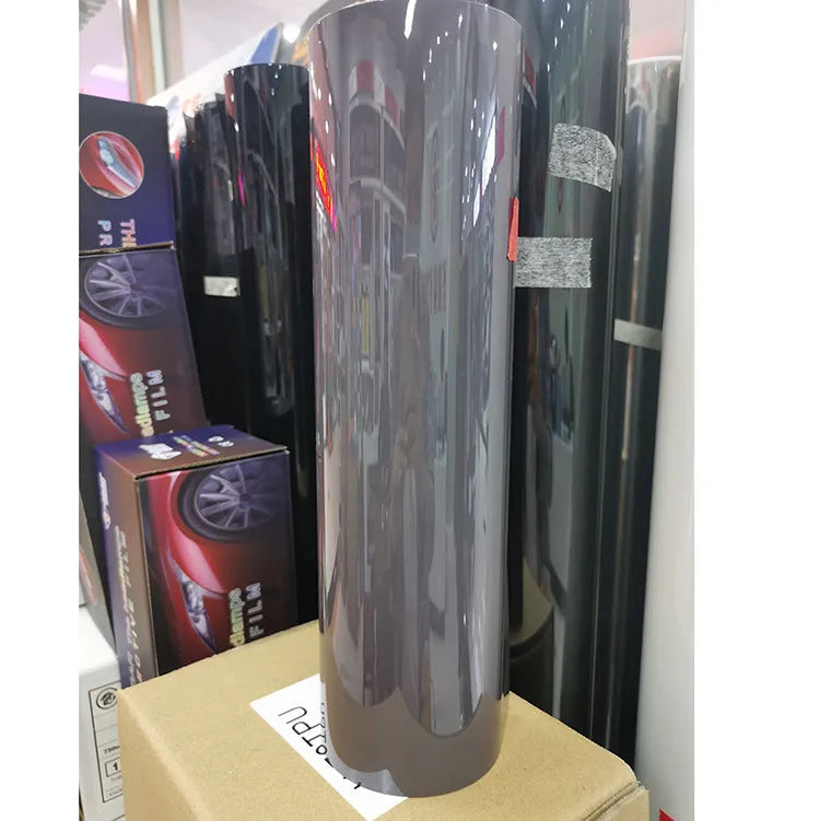 30cm wide plastic protective film roll for car LED lampshades in various colours including TPU dark grey and PVC black.