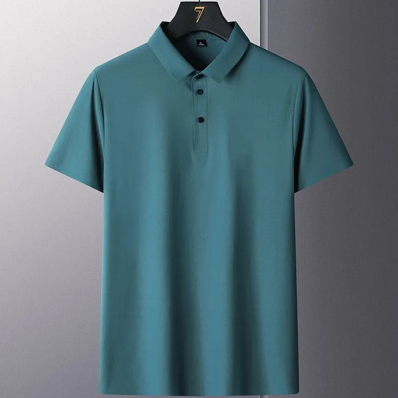 Man wearing a solid colour short sleeve non-ironing business casual shirt in a neutral tone.