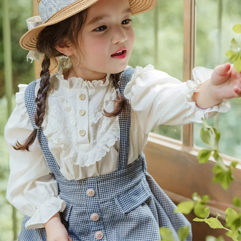 Cotton girls princess shirt with lace collar and long puff sleeves in beige on white background
