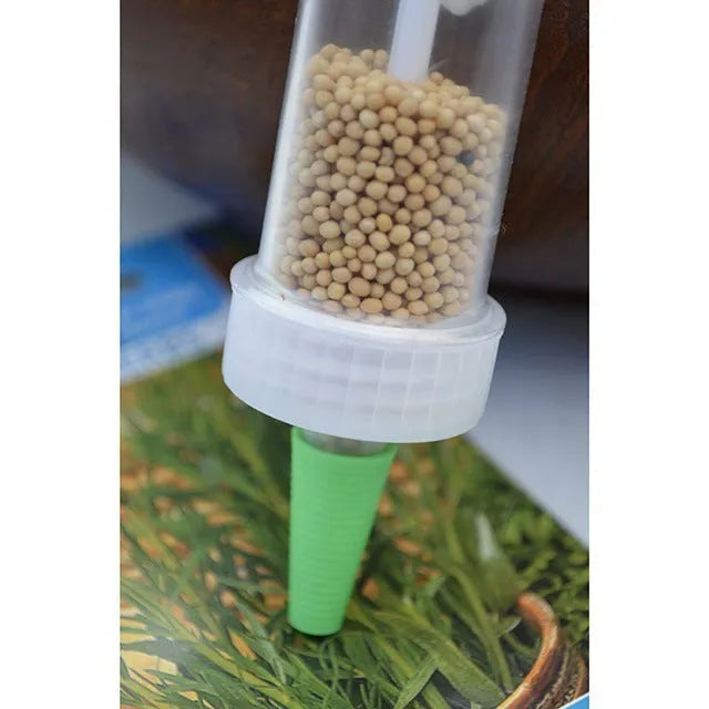 Plastic mini planter tool seeder measuring 12cm length for seed distribution in garden pots