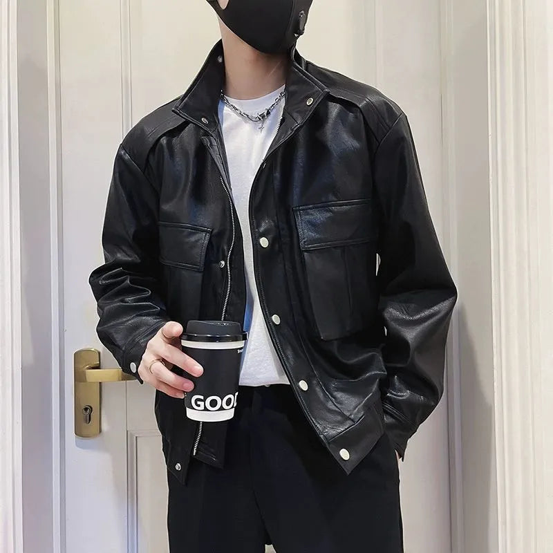 Men's black PU leather pilot jacket with side pockets and a straight hem, shown on a model.