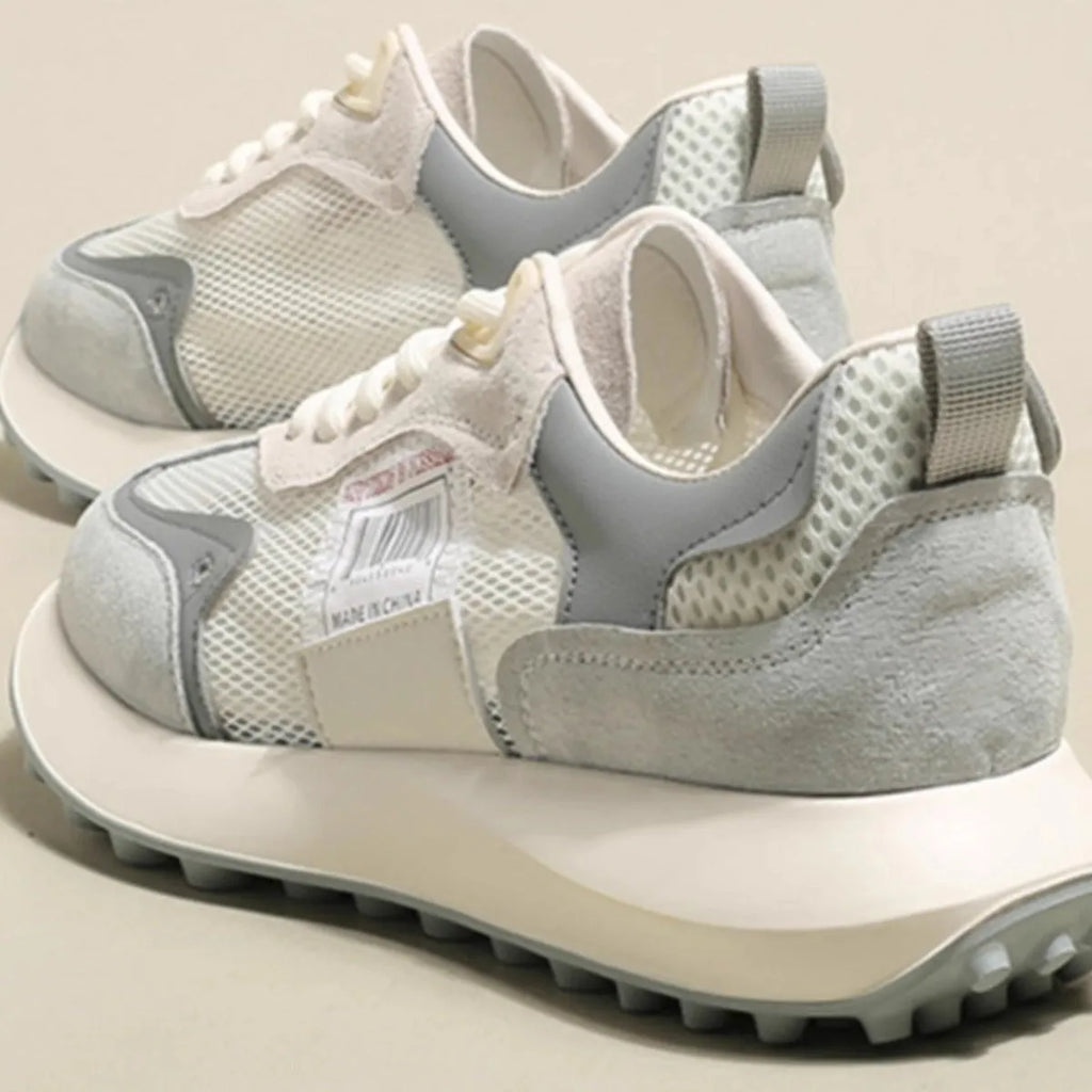 Women's grey and pink retro sneakers with low-top design and rubber soles