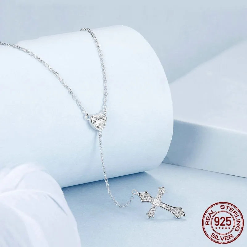 Silver Love Cross pendant necklace with O-ring chain on BSN384 colour background