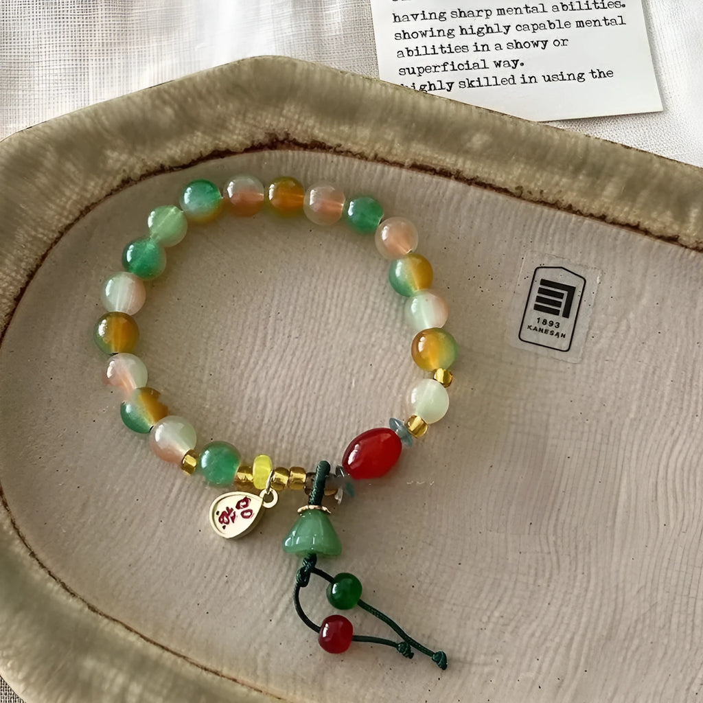 Handcrafted lotus ruyi bracelet with mixed materials and traditional Chinese design