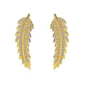 Leaf-shaped zircon inlaid S925 sterling silver stud earrings in gold colour on white background