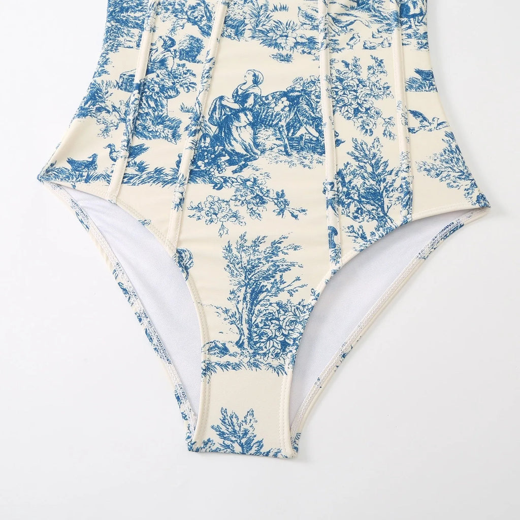 Blue women's one-piece swimsuit with a matching separate gauze skirt on a hanger.