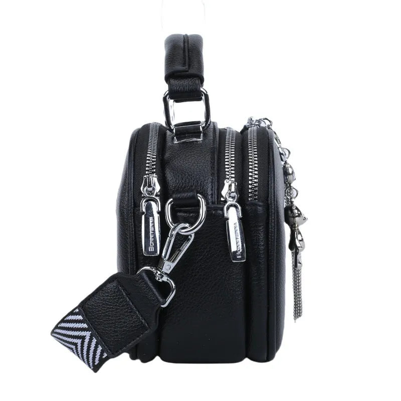 Women's small square bag with stitching detail showing oval shape and double shoulder straps