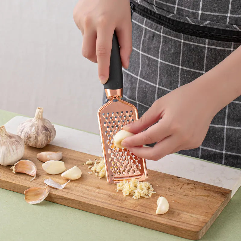 Seven-piece kitchen utensil set with stainless steel blades and copper-plated handles in multiple colour options
