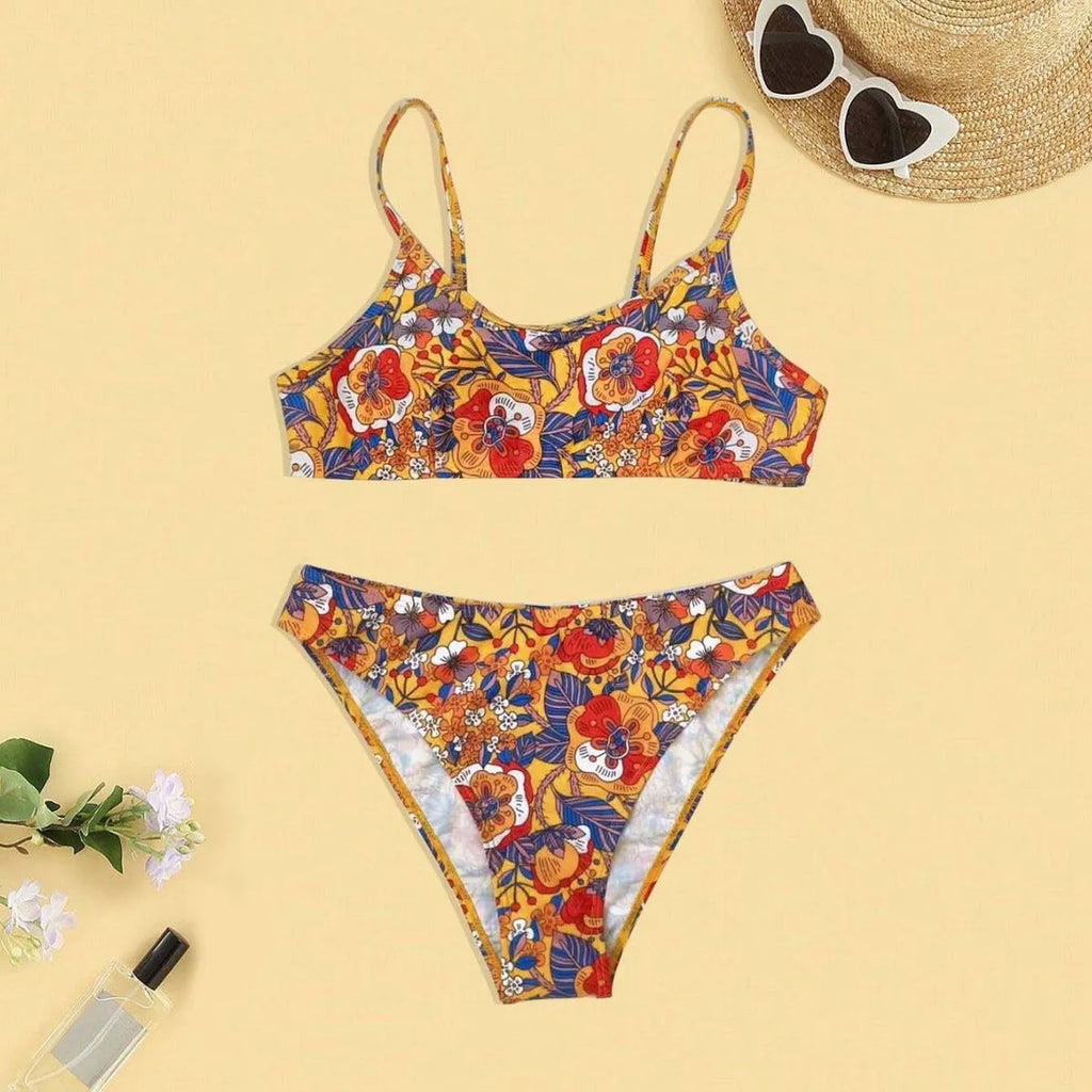 Plus size floral print strap women's bikini swimsuit with briefs style on a hanger.