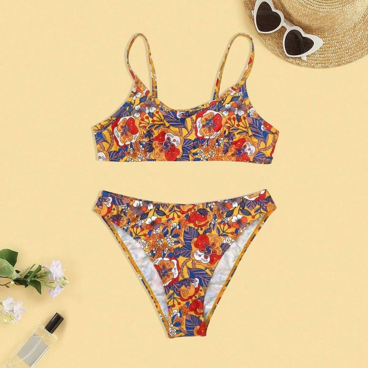 Plus size floral print strap women's bikini swimsuit with briefs style on a hanger.