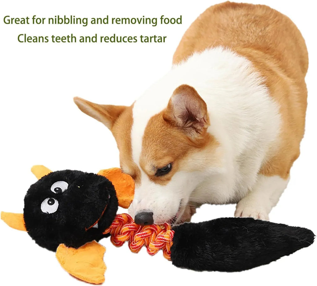 Plush cartoon dog toy with a squeaker and integrated rope knot on a green background.