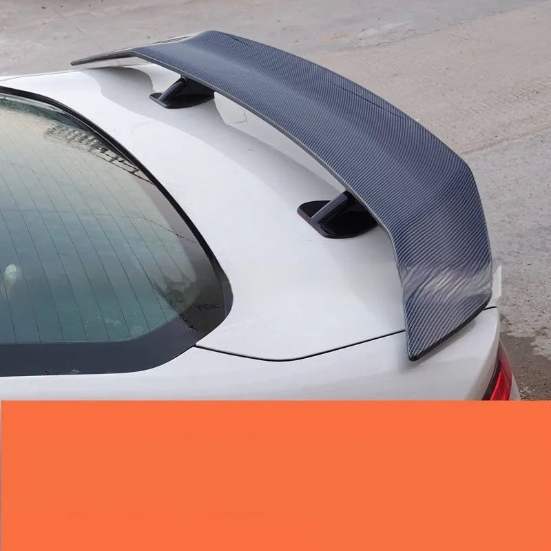 Universal punch-free fixed air design car spoiler tail wing in ABS plastic shown in various finish options.