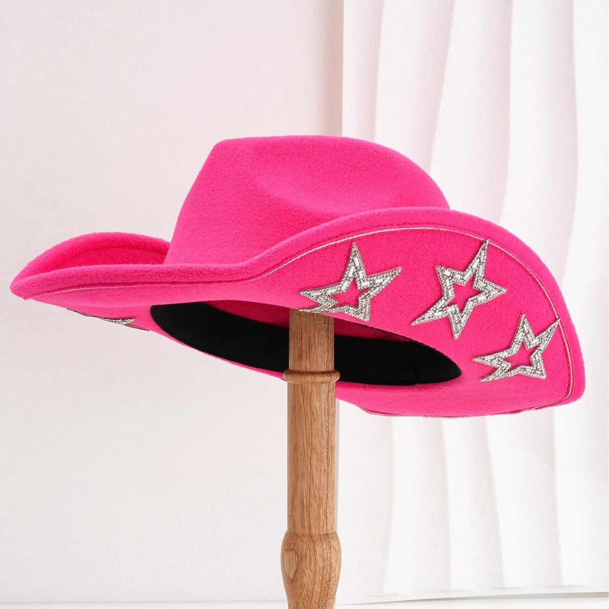 Beige wool felt western cowboy hat with a hexagonal star on the side, conical crown.