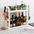 Foldable multi-layer kitchen storage rack in a choice of colours on a countertop.