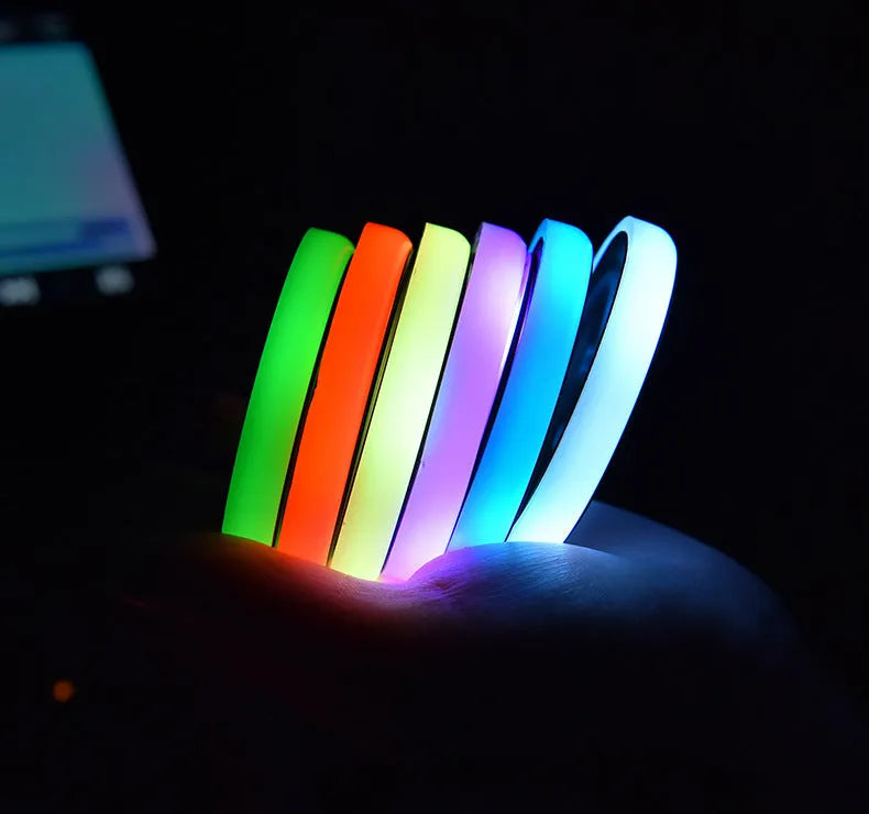 Colourful LED light-up coaster for car cup holder with non-slip surface and USB cable.