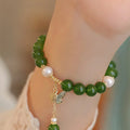 Natural green chalcedony women's bracelet with geometric shape and round design elements