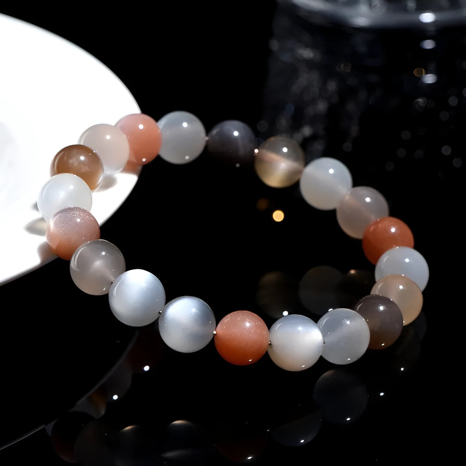Unisex moonstone bracelet with colourful moonlight 8mm beads on a white background.