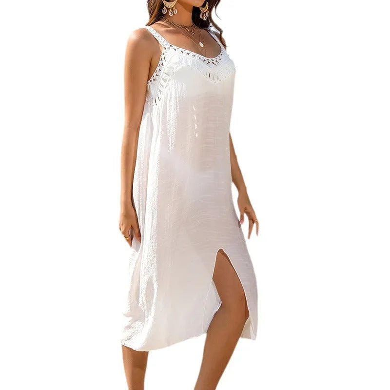 White women's crochet beach dress with hollow weave pattern and bottom slit
