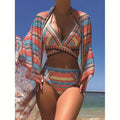 Women's blue three-piece bikini set with cross bandage bra, high-waisted briefs, and a matching smock.