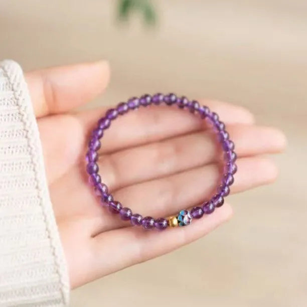 Nine purple lotus bracelet with mixed materials and retro styling for women.