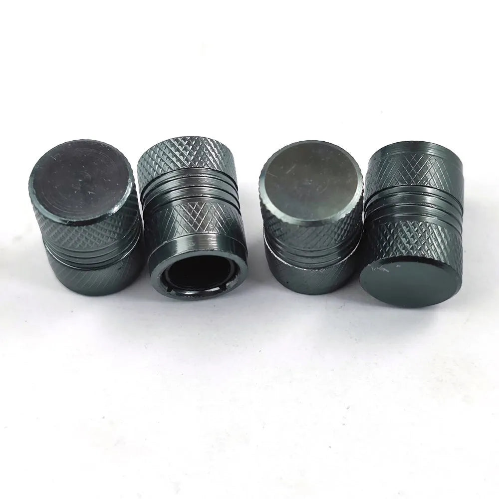 Aluminium car tyre valve dust cap in four colour options: black, blue, grey, and red.